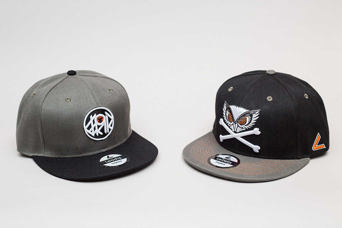 Two men's caps on a table