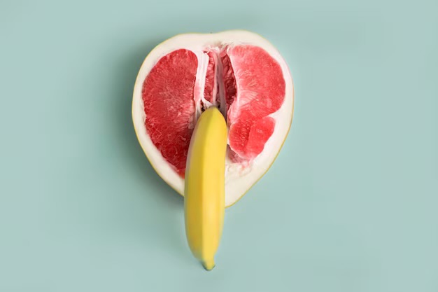 a grapefruit and banana in a sexual position